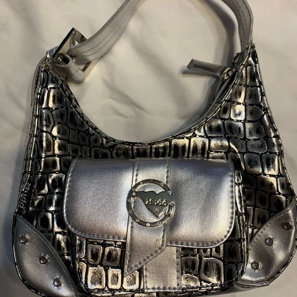 I am selling a bag/Purse The purse is small and  silver with black brand is mudd